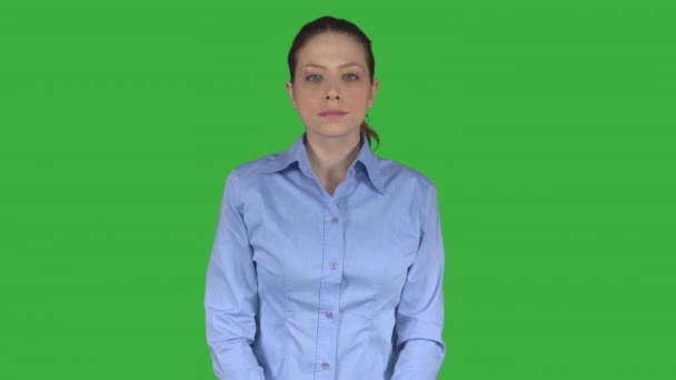 Female Executive smiles with hands on hips (Green Key) — Stock Video