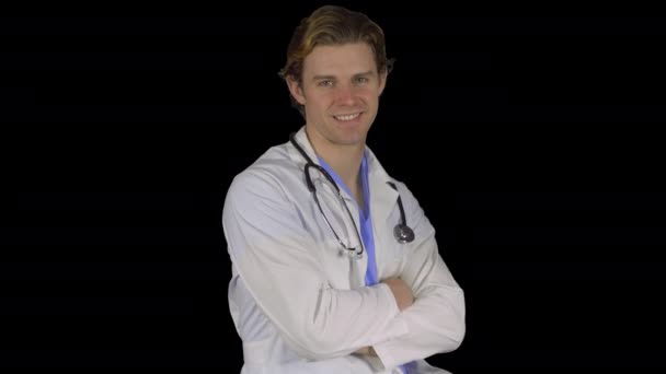 Friendly male doctor turns to camera (Transparent Background) — Stock Video