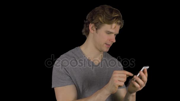 Attractive man texting (Transparent Background) — Stock Video