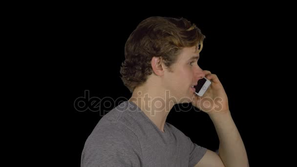 Side view of man talking on phone (Transparent Background) — Stock Video