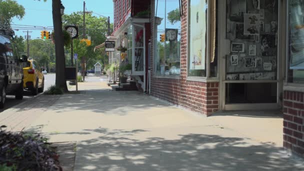 Man strolls down a sidewalk — Stock Video