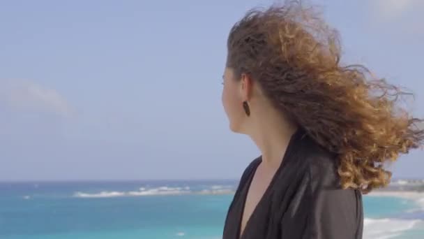 Beautiful womans hair is blown by the wind — Stock Video