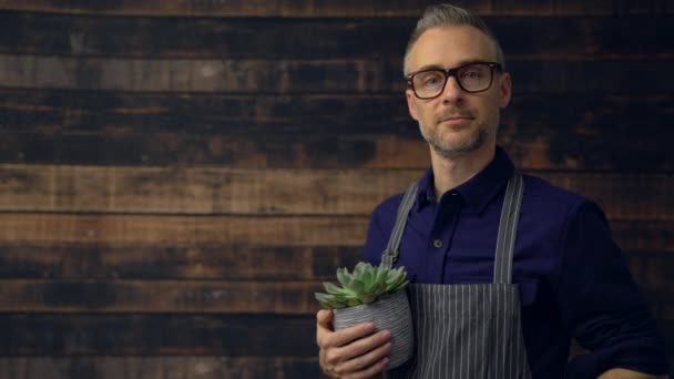 Floral business owner walks into frame and smiles — Stock Video