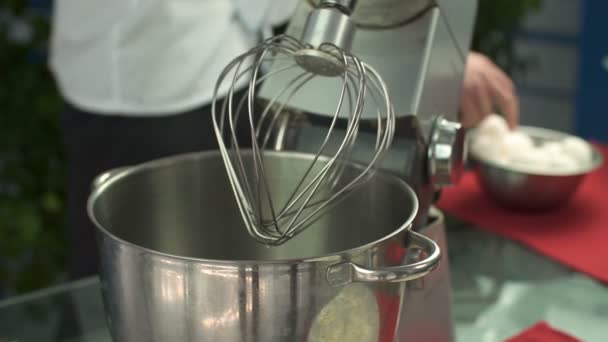 Cook cracking the Eggs into the Mixer — Stock Video