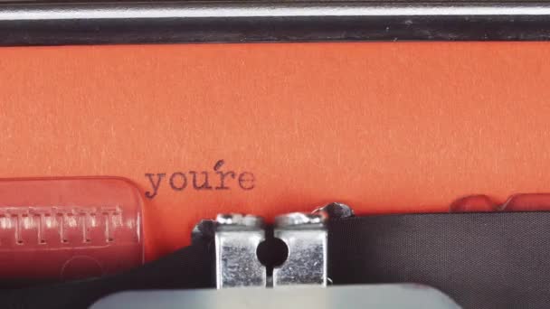 Youre in deep trouble - Typed on a old vintage typewriter. Printed on red paper. The red paper is inserted into the typewriter — Stock Video