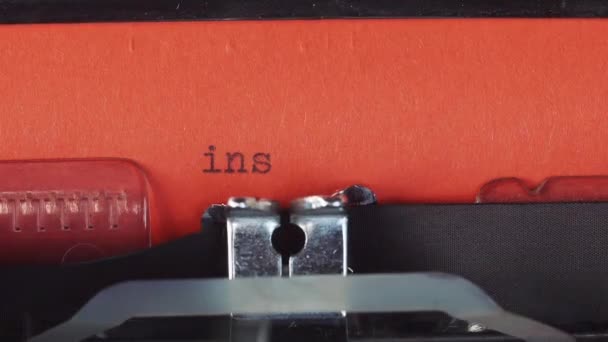 Instagram - Typed on a old vintage typewriter. Printed on red paper. The red paper is inserted into the typewriter — Stock Video