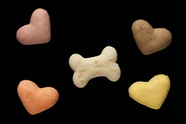 Dog cookies on a black background — Stock Photo, Image