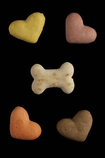 Dog cookies on a black background — Stock Photo, Image