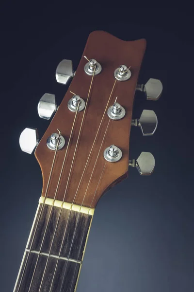 Close-up of a guitar on a dark background — Stock Photo, Image