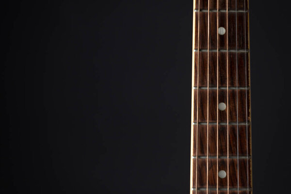 Detail of classic guitar with shallow depth of field. Closeup image of acoustic guitar fingerboard, Photography classical guitar on a light background