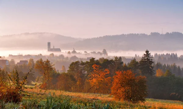Tower of rural church in misty autumn morning. — Stock Photo, Image