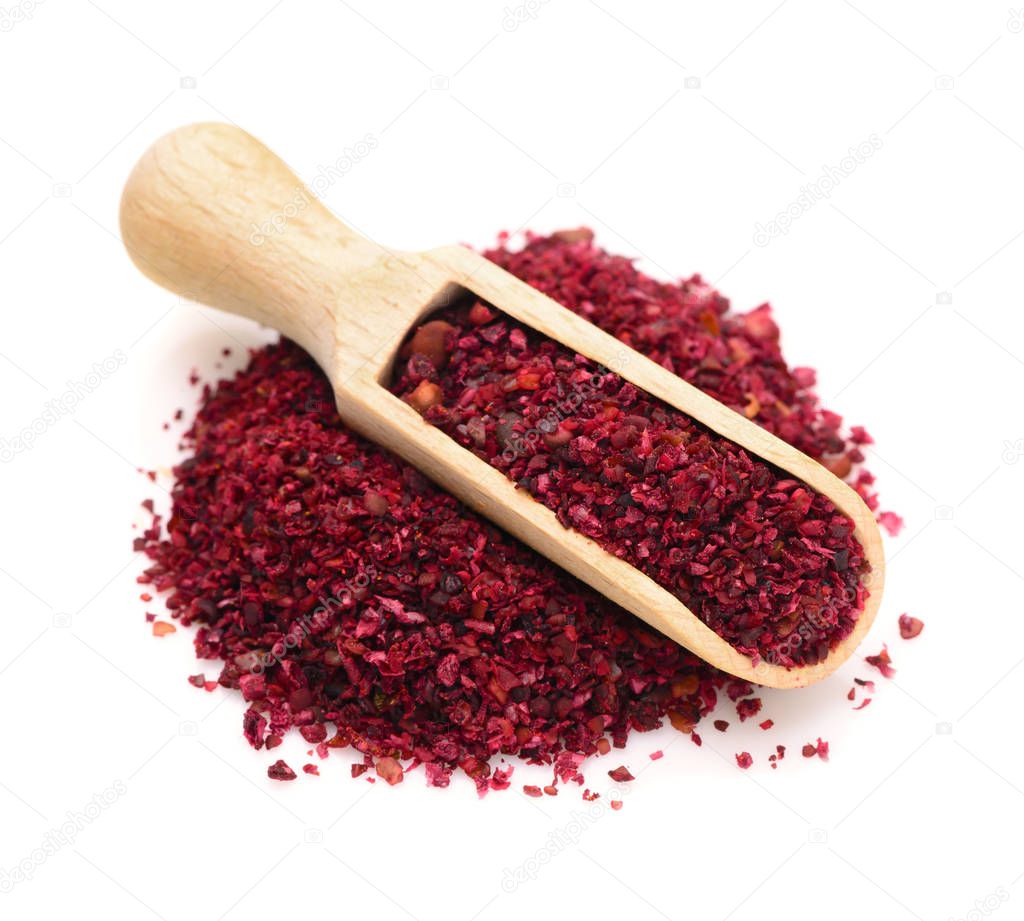 Sumac in a wooden scoop for spices