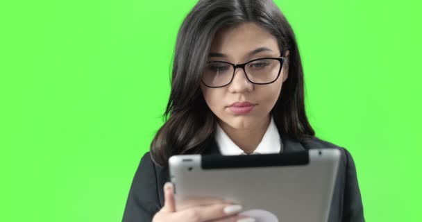 Concentrated young lady working with tablet — Stock Video