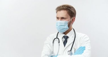 Competent doctor in medical unifrom, gloves and mask