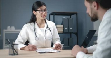 Doctors Talking in Office