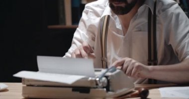 Bearded Male Writer Working in Darkness