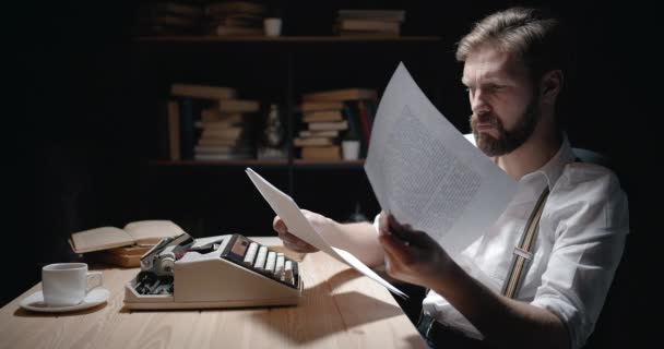 Bearded Writer Checking Typed Pages — Stockvideo
