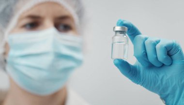 Medical doctor holding vaccine