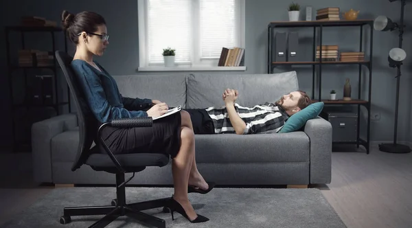 Lying man speaking with psychologist