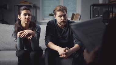 Attentive couple listen to psychologue