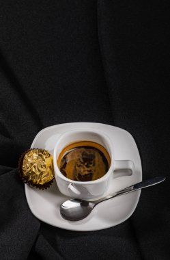 Coffee and wrapped chocolate candy