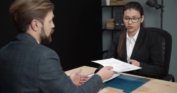 Confident man giving resume to female hr manager — Stockvideo