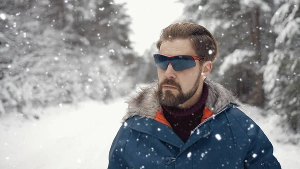 Man in snowy forest portrait — Stok fotoğraf