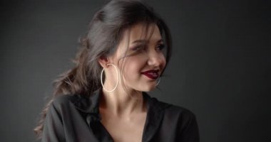 Fashion portrait of young brunette lady with bright makeup
