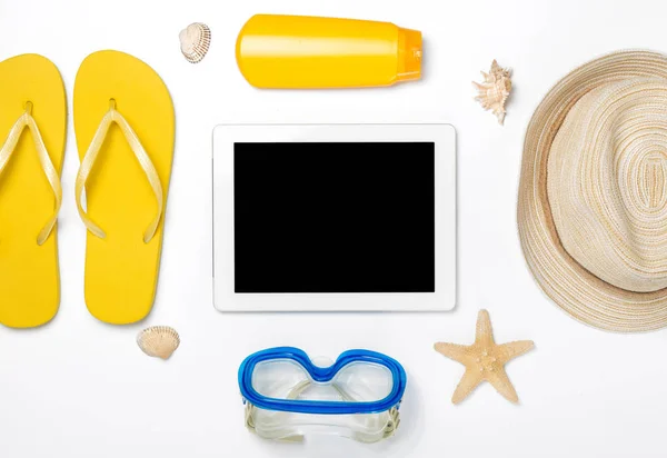 Beach accessories around tablet with copy space on white backgro — Stock Photo, Image