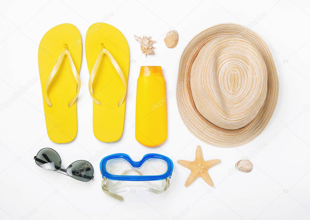 Variety beach accessories on white background. Vacation and trav