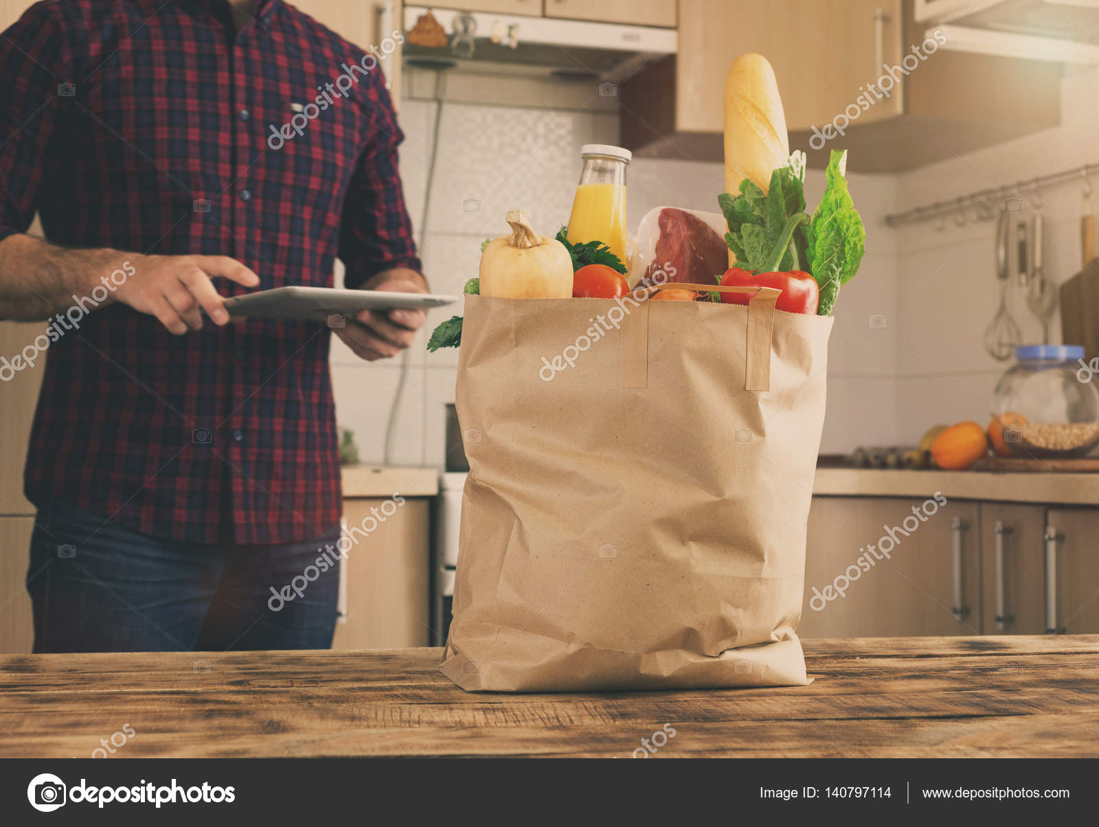 Full Paper Bag Of Different Food In The Home Kitchen Stock Photo