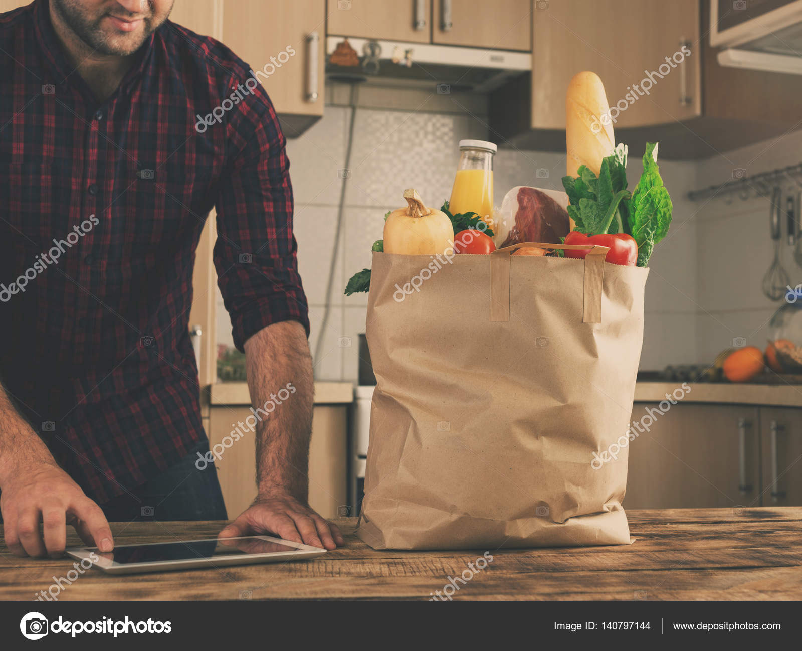 Full Paper Bag Of Vegetables And Fruit On Wooden Table Stock