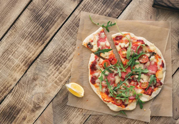 Italian pizza on wooden — Stock Photo, Image