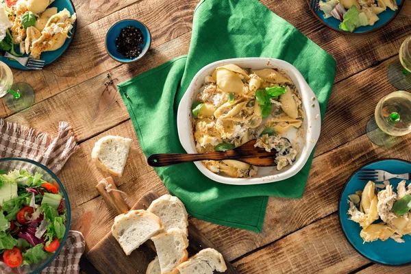 Dinner table with Italian pasta, salad and wine — Stock Photo, Image