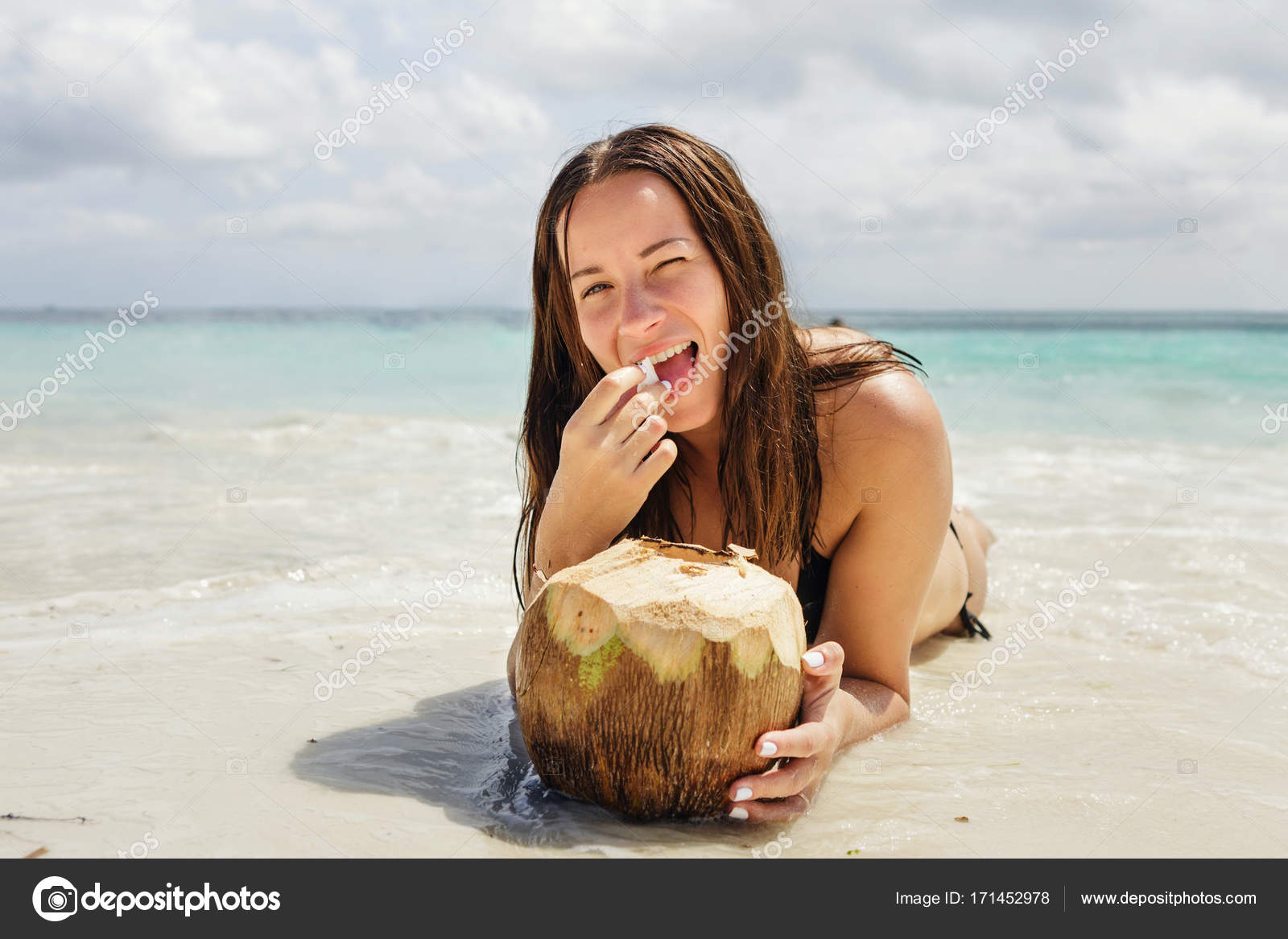 Beautiful woman eating fresh coconut — Stock Photo © KucherAndrey 171452978