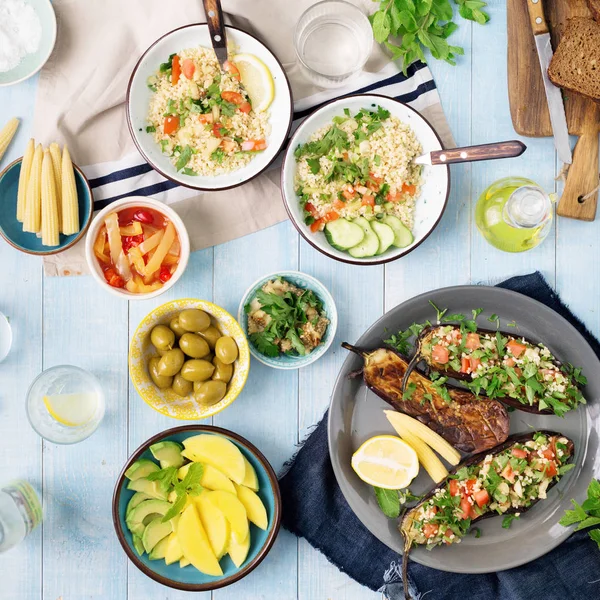 Set of healthy vegetarian food on a wooden table — Stock Photo, Image