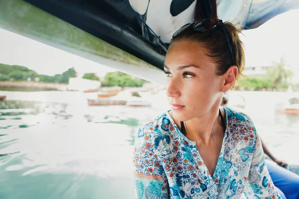 Travel lifestyle. Portrait of woman traveler in boat