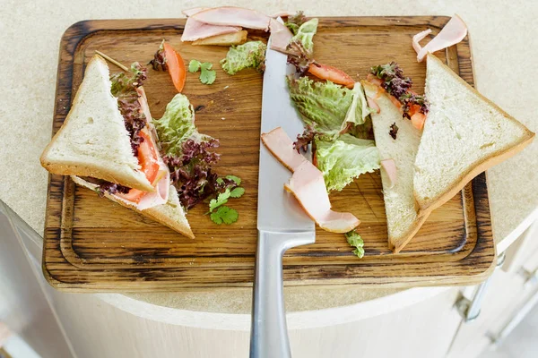 Preparation of sandwich. Sandwiches on the kitchen board