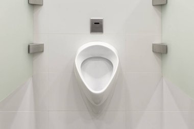 White toilet bowl arranged in the male bathroom clipart