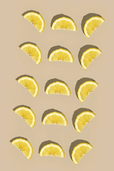 Fruit summer pattern. Lemon slice close up on light background