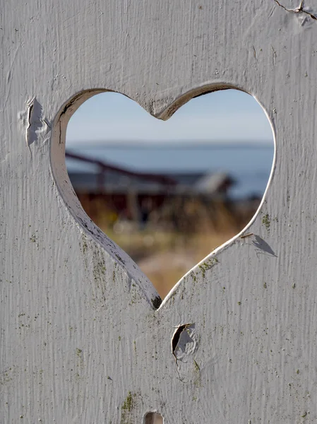 Close Heart Shaped Hole Cut Out White Painted Wooden Board — Stock Photo, Image