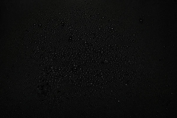 Water Druppels Zwarte Achtergrond Bovenaanzicht — Stockfoto