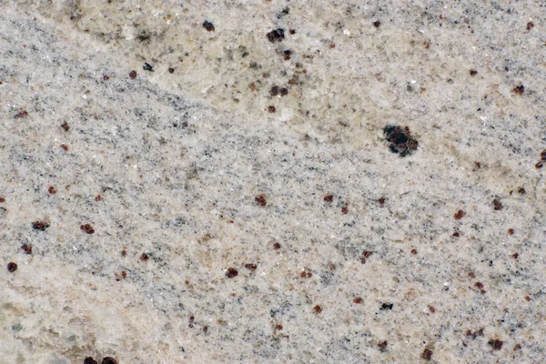 Гранит из натурального полированного камня, называемый Кашмирским белым — стоковое фото