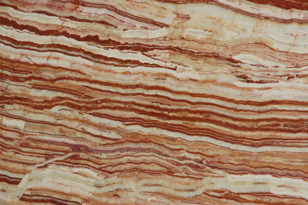 La textura de las piedras naturales con hermosas rayas de colores blancos y exuberantes de lava se llama Onice Tiger — Foto de Stock