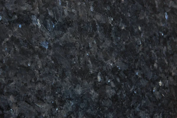 Mavi parıltılı gri granitin arka planı, bu doğal taşın adı Mavi İnci..