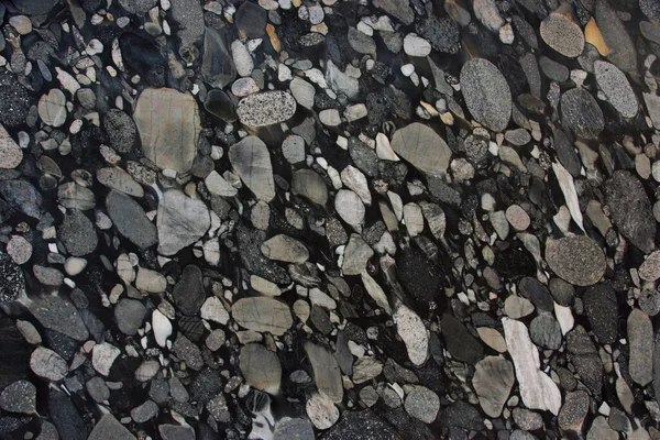 背景は黒と灰色の花崗岩で作られており 異なる石が凍結しており この天然石はNero Marinaceと呼ばれています — ストック写真