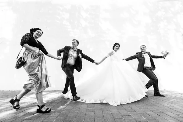 Newlyweds and their friends having fun