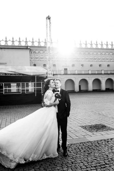 Gorgeous newlyweds by beautiful old castle