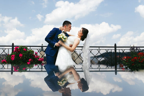 Happy newlyweds in old european city