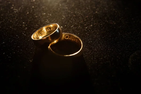 Wedding rings with names inside — Stock Photo, Image